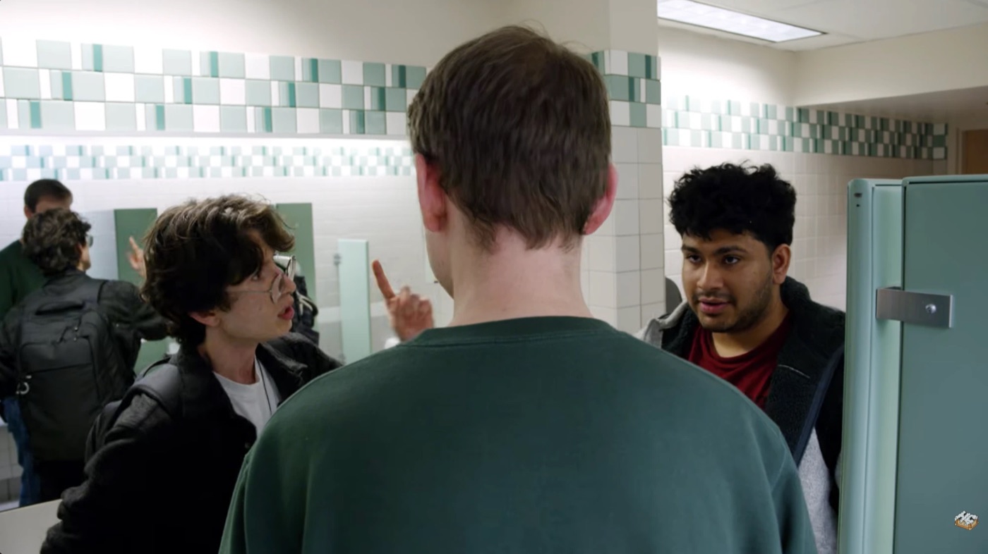 Sree as Chase reacting during a bathroom argument