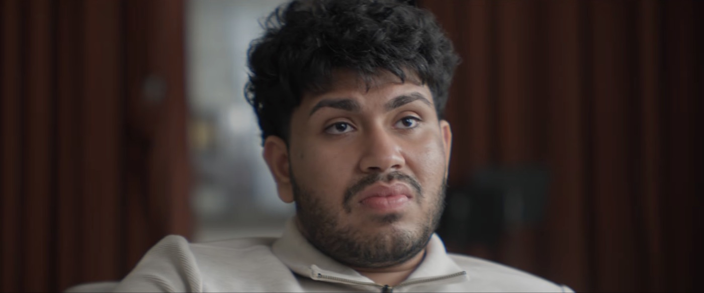 Sree as Aaron in a therapist’s chair, mid-thought